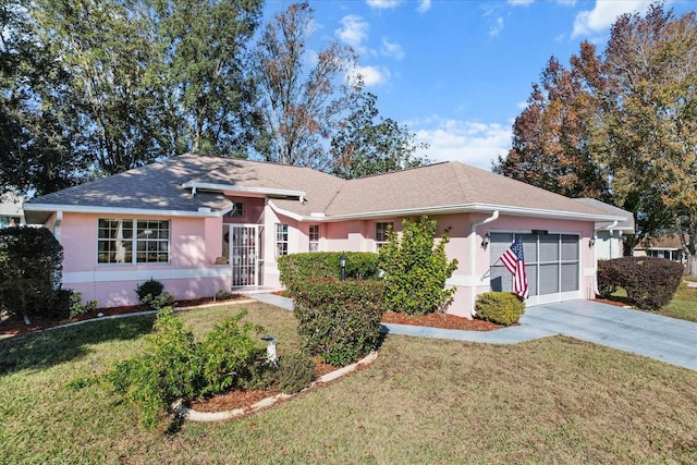 single story home featuring a front lawn and a garage