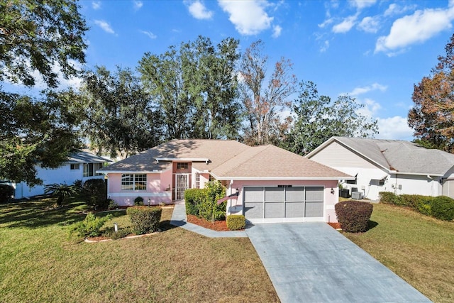 ranch-style house with a garage and a front lawn