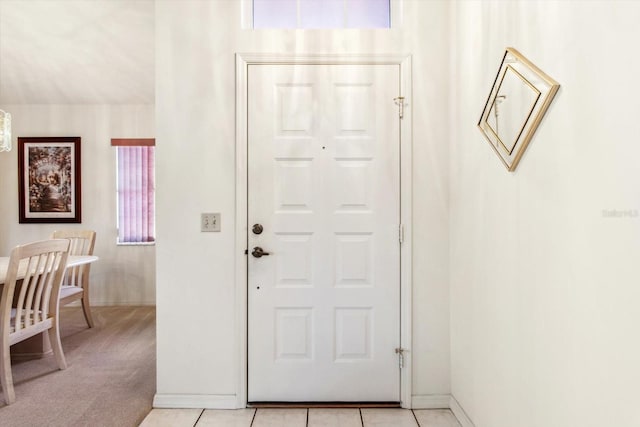 view of carpeted entrance foyer