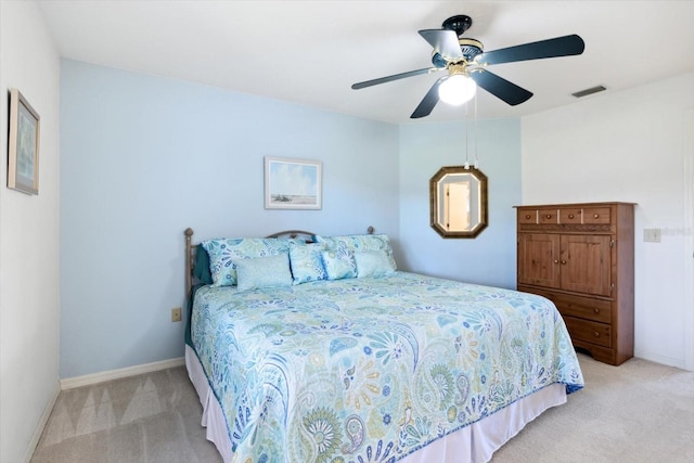 bedroom featuring ceiling fan and light colored carpet