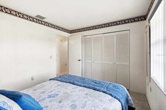 carpeted bedroom with a closet