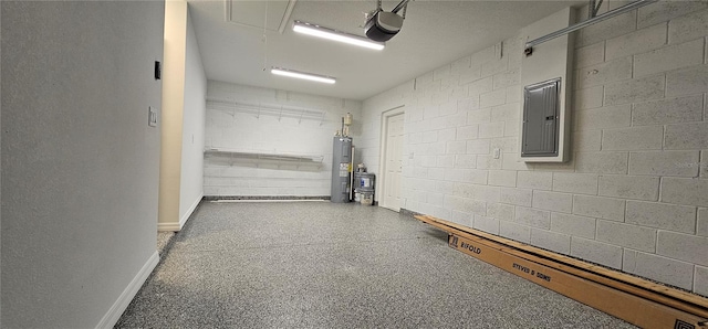 garage featuring concrete block wall, electric panel, a garage door opener, and electric water heater