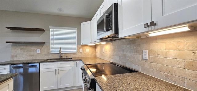 kitchen with electric range, dishwasher, stainless steel microwave, white cabinetry, and a sink