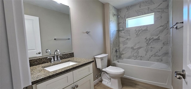 full bath with vanity, tub / shower combination, wood finished floors, and toilet