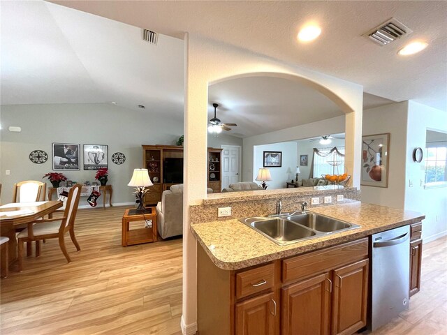 kitchen with visible vents, a ceiling fan, dishwasher, open floor plan, and a sink