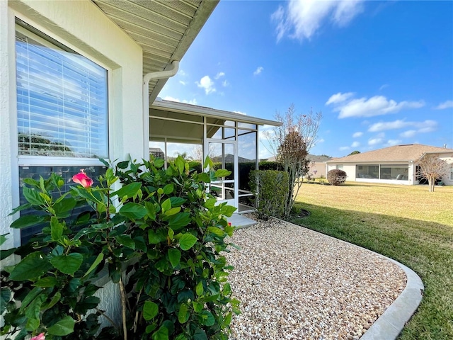 view of yard with a sunroom