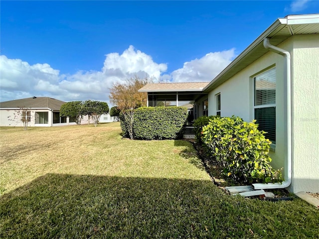 view of yard featuring a sunroom