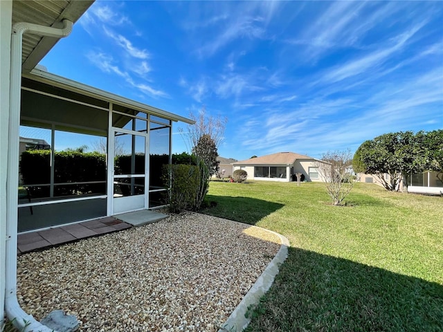 view of yard with a sunroom