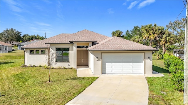 view of front of home featuring a garage and a front lawn