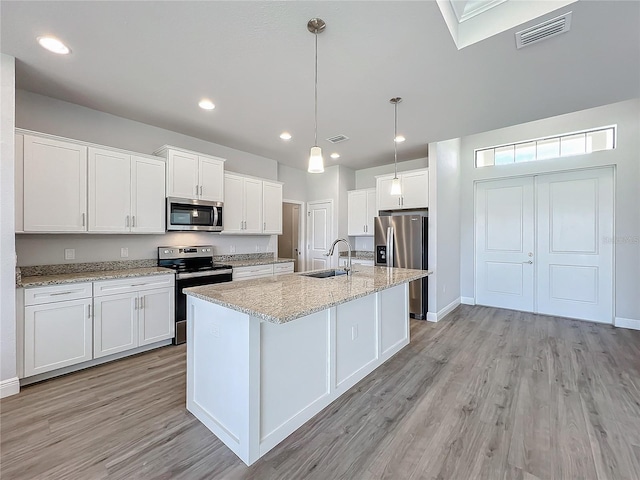 kitchen with sink, white cabinetry, and stainless steel appliances