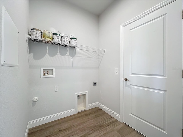 washroom with hookup for an electric dryer, washer hookup, hookup for a gas dryer, and hardwood / wood-style flooring