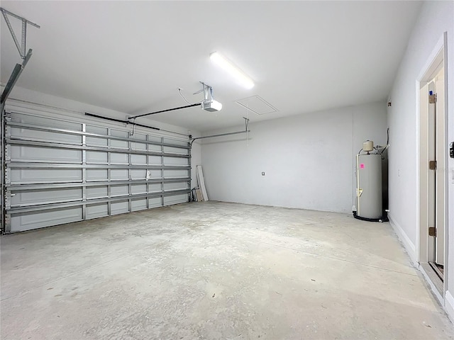 garage featuring water heater and a garage door opener