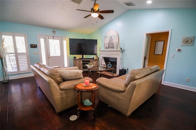 living room with lofted ceiling, ceiling fan, and dark hardwood / wood-style floors