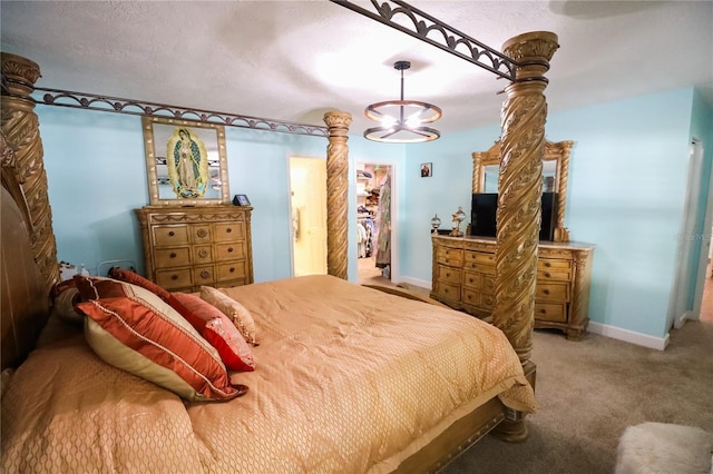 bedroom featuring carpet floors, a textured ceiling, and a chandelier