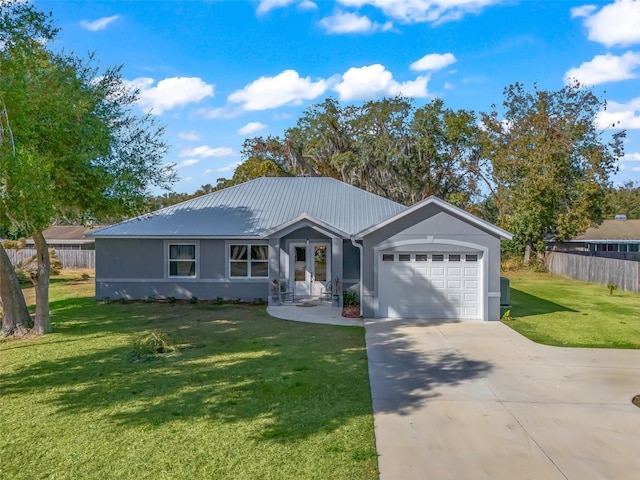 single story home featuring a front lawn and a garage