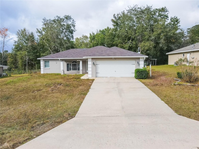 ranch-style house with a garage and a front lawn