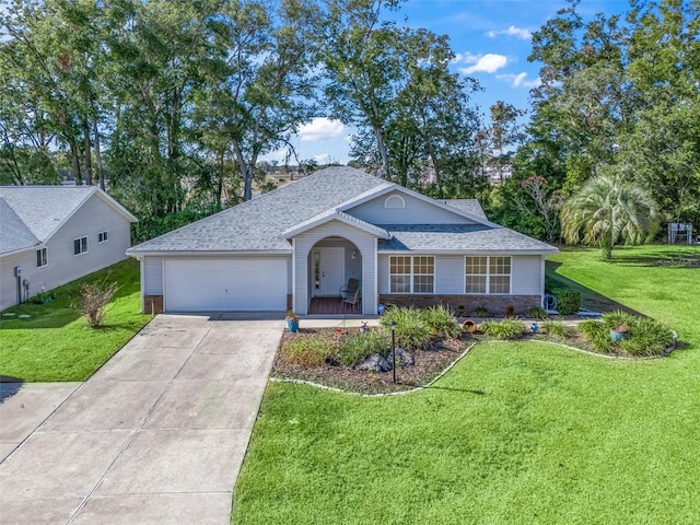 ranch-style home with a front yard and a garage