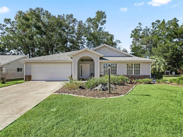 single story home featuring a front yard and a garage