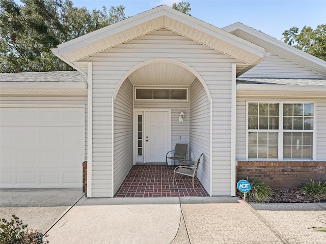 property entrance with a garage