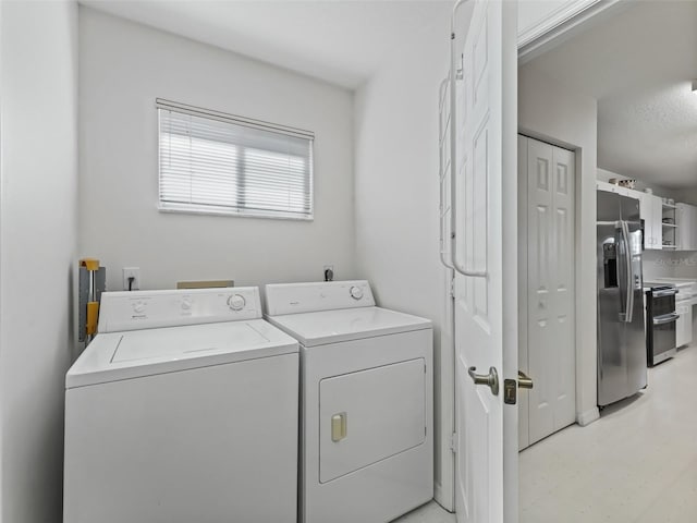 laundry area with separate washer and dryer