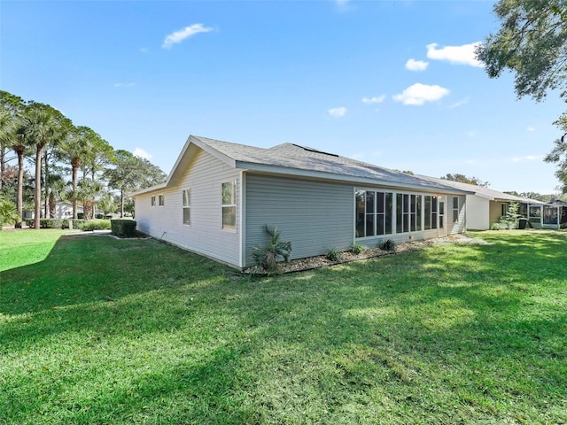 view of home's exterior with a yard