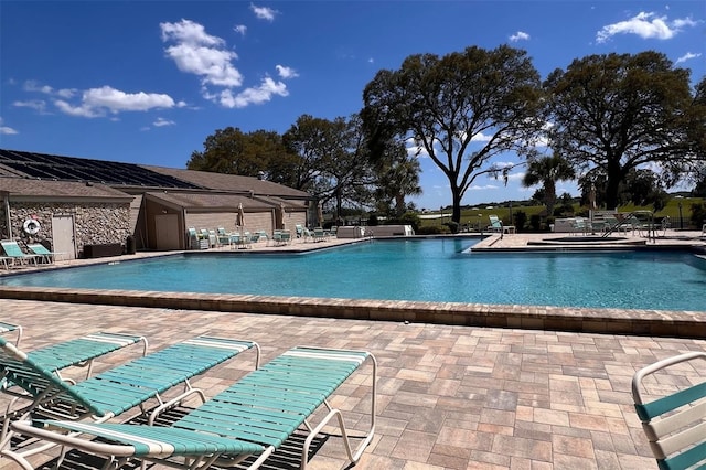 view of swimming pool featuring a patio