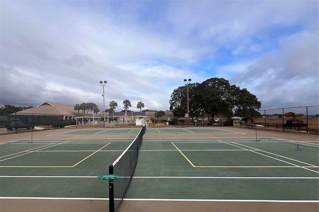 view of tennis court featuring basketball court