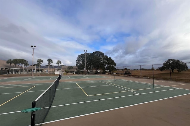 view of sport court with basketball hoop