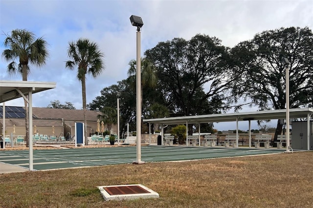 view of property's community with a lawn