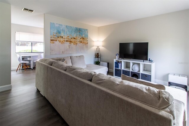 living room with dark wood-type flooring