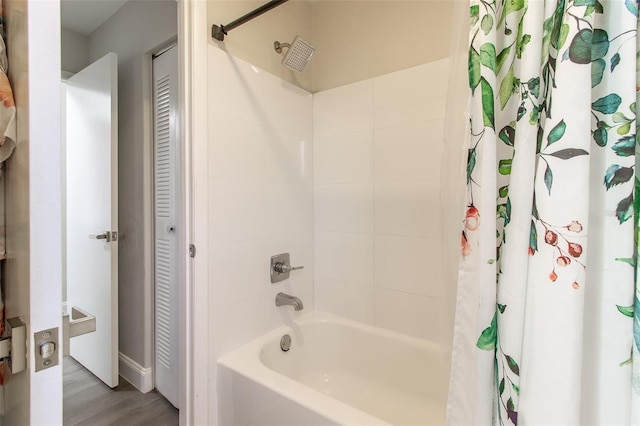 bathroom with shower / bath combination with curtain and hardwood / wood-style flooring