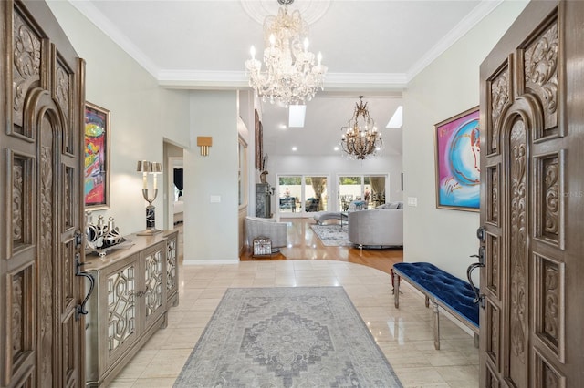 foyer with a chandelier, light tile patterned floors, and crown molding