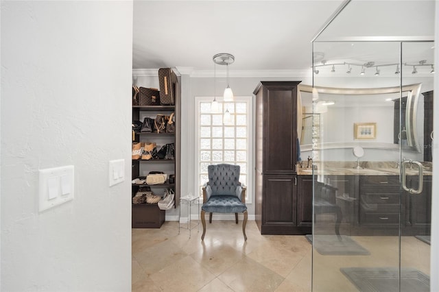 sitting room featuring crown molding