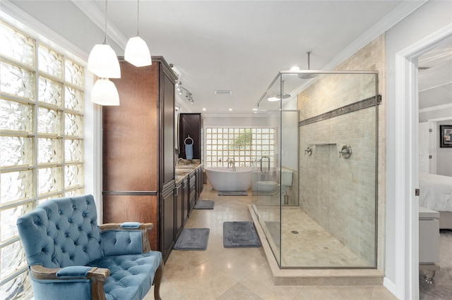 bathroom with vanity, separate shower and tub, and crown molding