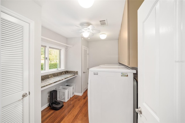 washroom featuring hardwood / wood-style floors, ceiling fan, cabinets, and washer / clothes dryer