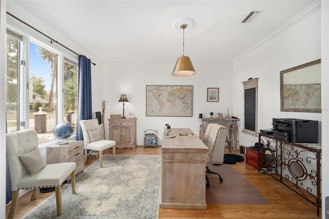 office space featuring crown molding and light hardwood / wood-style flooring