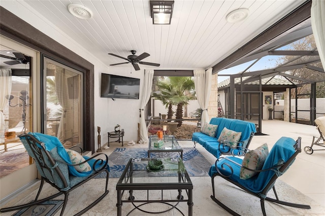 view of patio / terrace with outdoor lounge area, glass enclosure, and ceiling fan