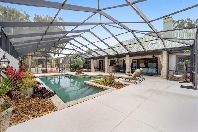 view of pool with a lanai, outdoor lounge area, ceiling fan, and a patio