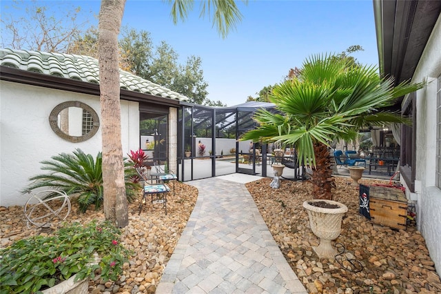 view of patio / terrace featuring a lanai