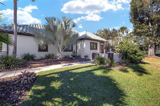 exterior space with a yard