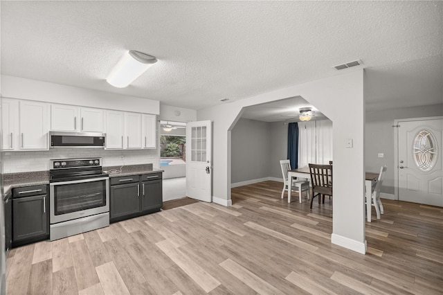 kitchen with ceiling fan, appliances with stainless steel finishes, gray cabinetry, a textured ceiling, and white cabinets