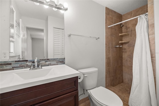 bathroom with toilet, vanity, backsplash, a shower with curtain, and a textured ceiling