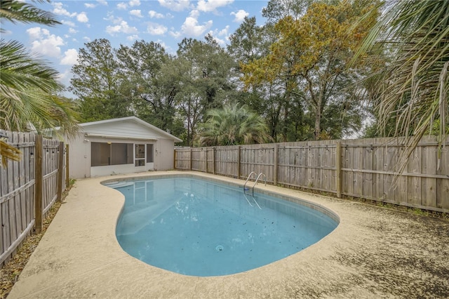 view of swimming pool featuring a sunroom