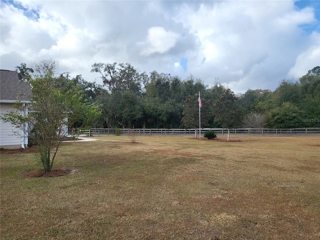 view of yard with a rural view