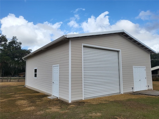 garage with a yard