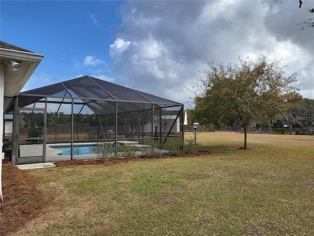 view of yard featuring glass enclosure