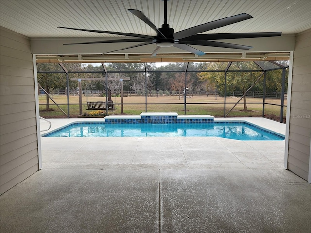 view of swimming pool featuring ceiling fan, a patio area, and glass enclosure