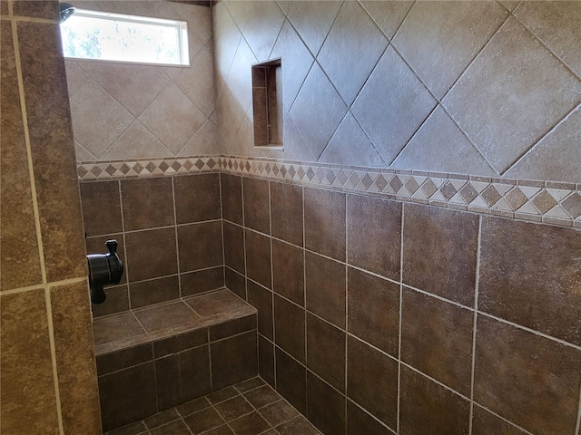 bathroom featuring tiled shower