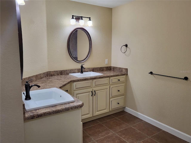 bathroom featuring tile patterned flooring and vanity