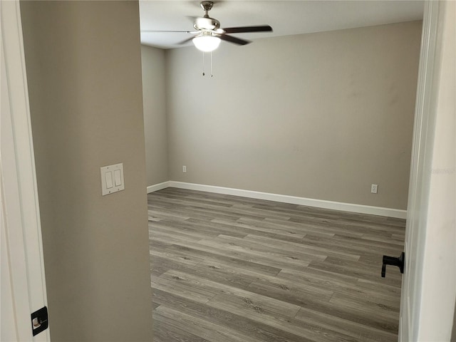 unfurnished room featuring hardwood / wood-style floors and ceiling fan